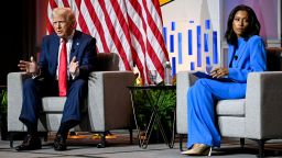 Republican presidential nominee and former U.S. President Donald Trump speaks on a panel of the National Association of Black Journalists (NABJ) convention as Rachel Scott, senior congressional correspondent for ABC News, looks away, in Chicago, Illinois, U.S. July 31, 2024. REUTERS/Vincent Alban