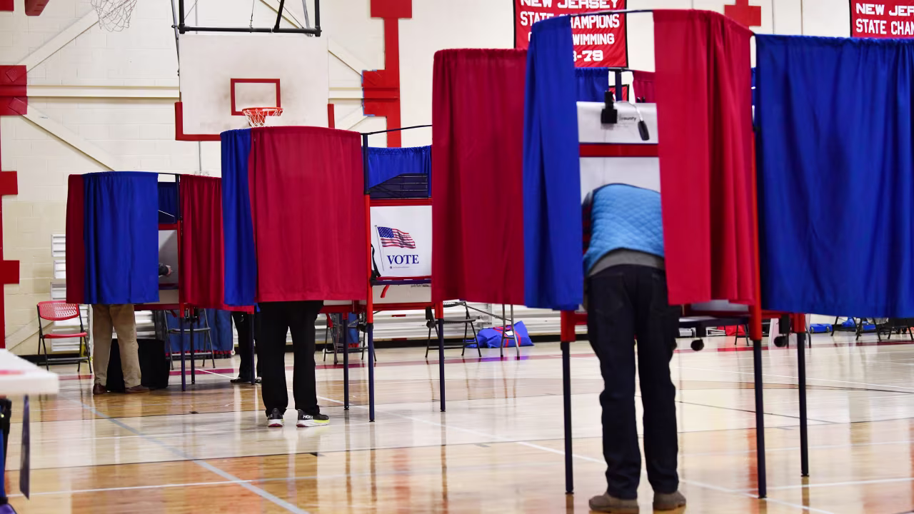 Voters cast their ballots in the early morning at a high school in Cherry Hill, New Jersey.