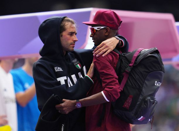 Italian high jumper Gianmarco Tamberi, left, speaks with Qatar's Mutaz Essa Barshim during the qualification round on August 7. The two shared a gold medal in the event three years ago in Tokyo. When Barshim pulled up with an apparent injury in Paris, <a href="https://www.cnn.com/sport/live-news/paris-olympics-news-2024-08-07#h_8ace76e36b6f5578104aedf12feead39">Tamberi was the first to check on him</a>. Barshim was able to recover and qualify for the final.