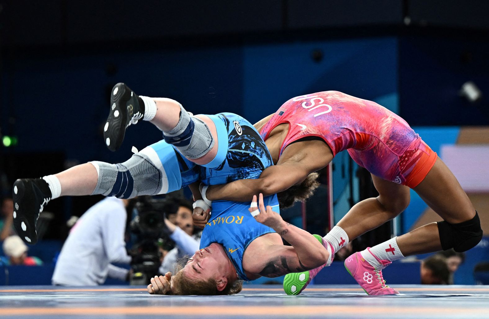 Romania's Cătălina Axente, left, and the United States' Kennedy Blades compete in freestyle wrestling on August 10. Blades went on to win silver. Axente had to receive medical attention after landing on her neck during a throw.