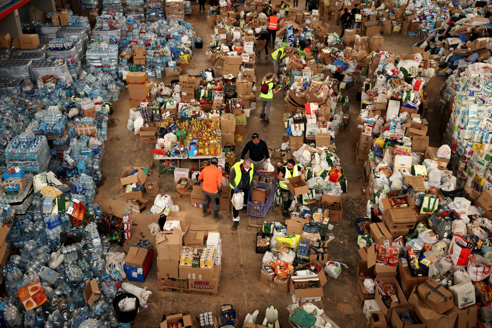 Volunteers arrange donations at a gymnasium in Sedavi on Sunday.