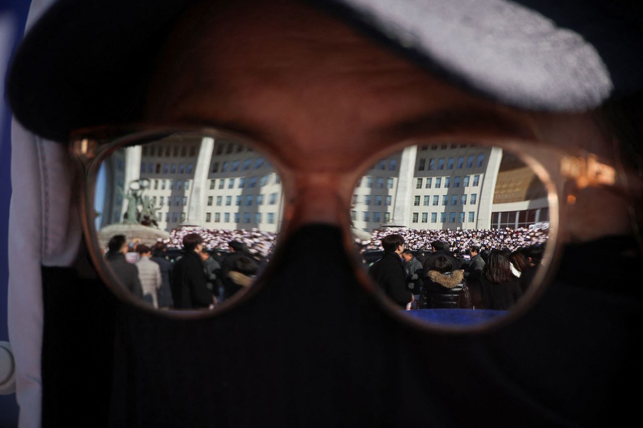 A protester attends a rally to condemn Yoon.