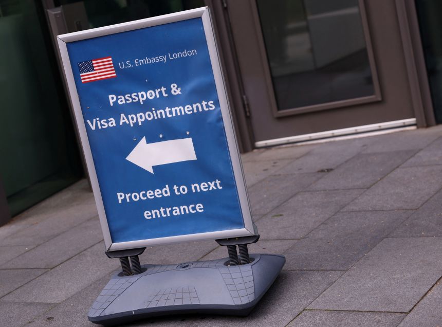 An information sign for passport and visa appointments is displayed outside the US. embassy in London, on May 29.