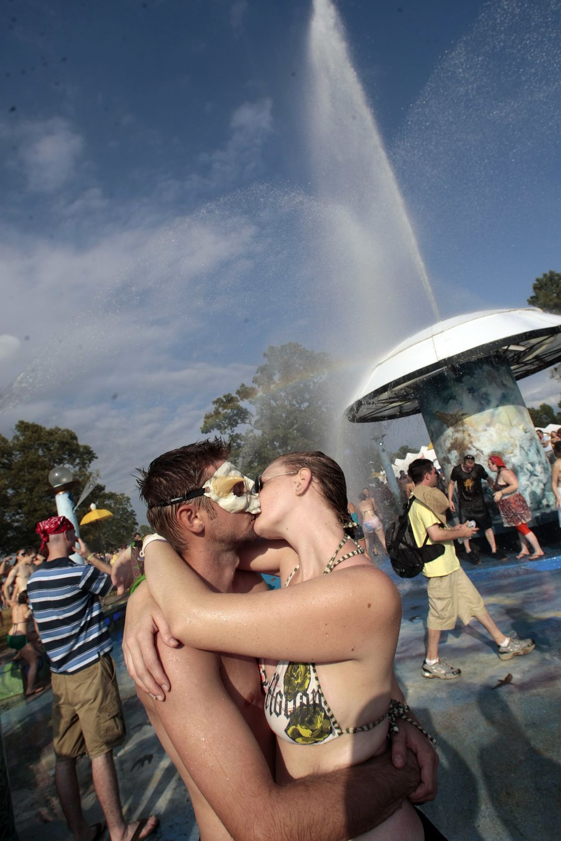 Chris Shepherd and Melody Perry embrace after cooling off in the fountain at Bonnaroo in 2009.