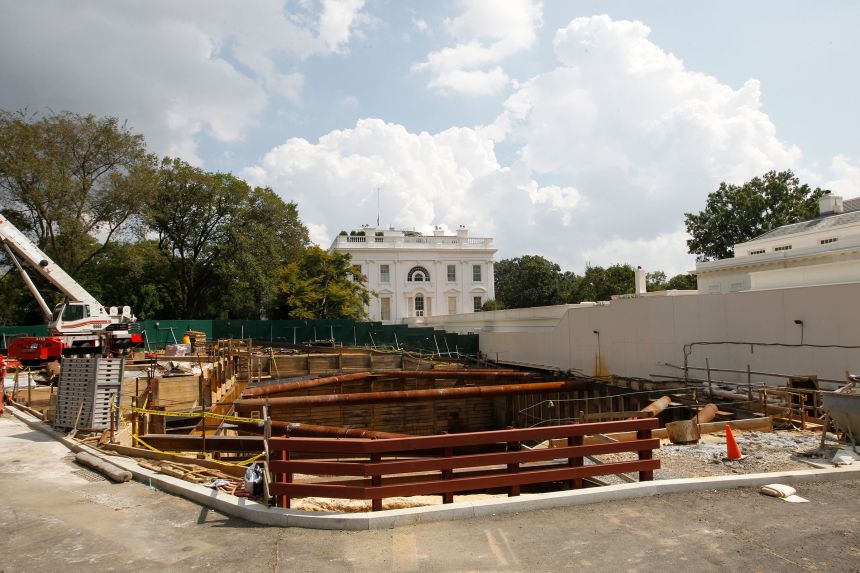 A deep hole is seen as construction continues in front of the West Wing of the White House, in 2011, during the presidency of Barack Obama.