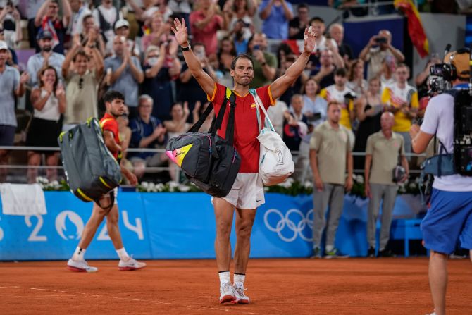 Spain's Rafael Nadal waves goodbye after he and doubles partner Carlos Alcaraz <a >were knocked out in the quarterfinals</a> by the United States' Austin Krajicek and Rajeev Ram on July 31. Nadal’s future in tennis is uncertain as injuries continue to plague him.