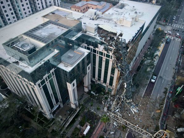 The building that houses the Tampa Bay Times newspaper was damaged when a construction crane fell during the storm in St. Petersburg, Florida.