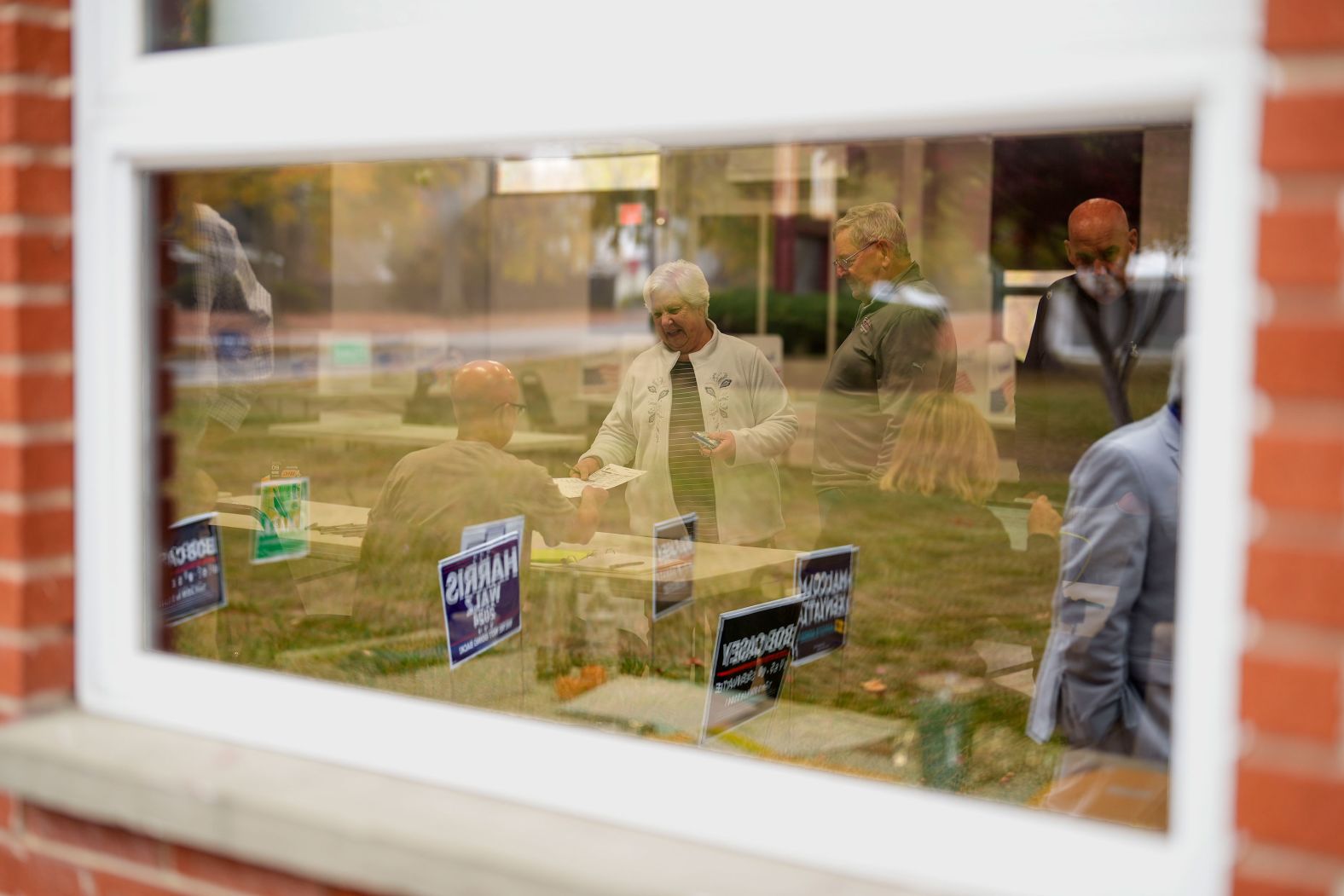 Voters receive their ballots at a polling place in Springfield, Pennsylvania, on Tuesday.