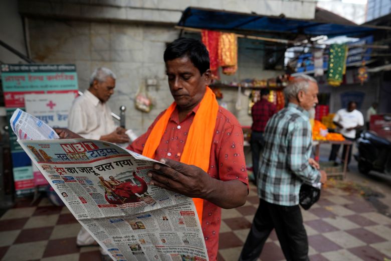 A man reads a Hindi-language newspaper in Lucknow, Uttar Pradesh, India, in November 2024.