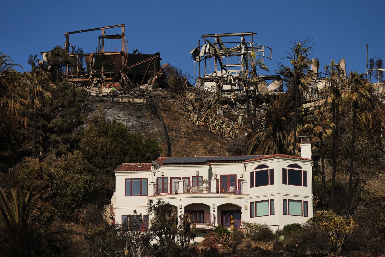 The remains of homes in Malibu destroyed by the Palisades Fire are seen Thursday.