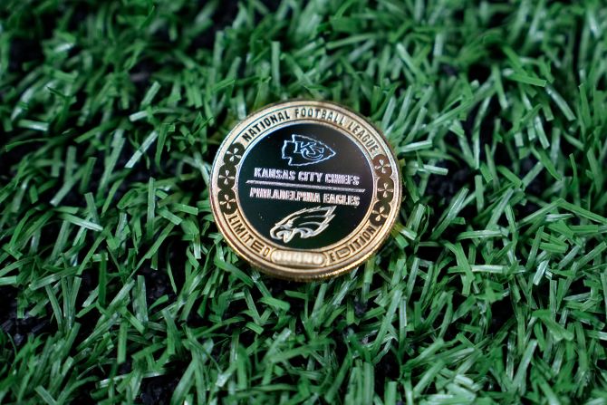 The official Super Bowl coin sits on the field before the game.