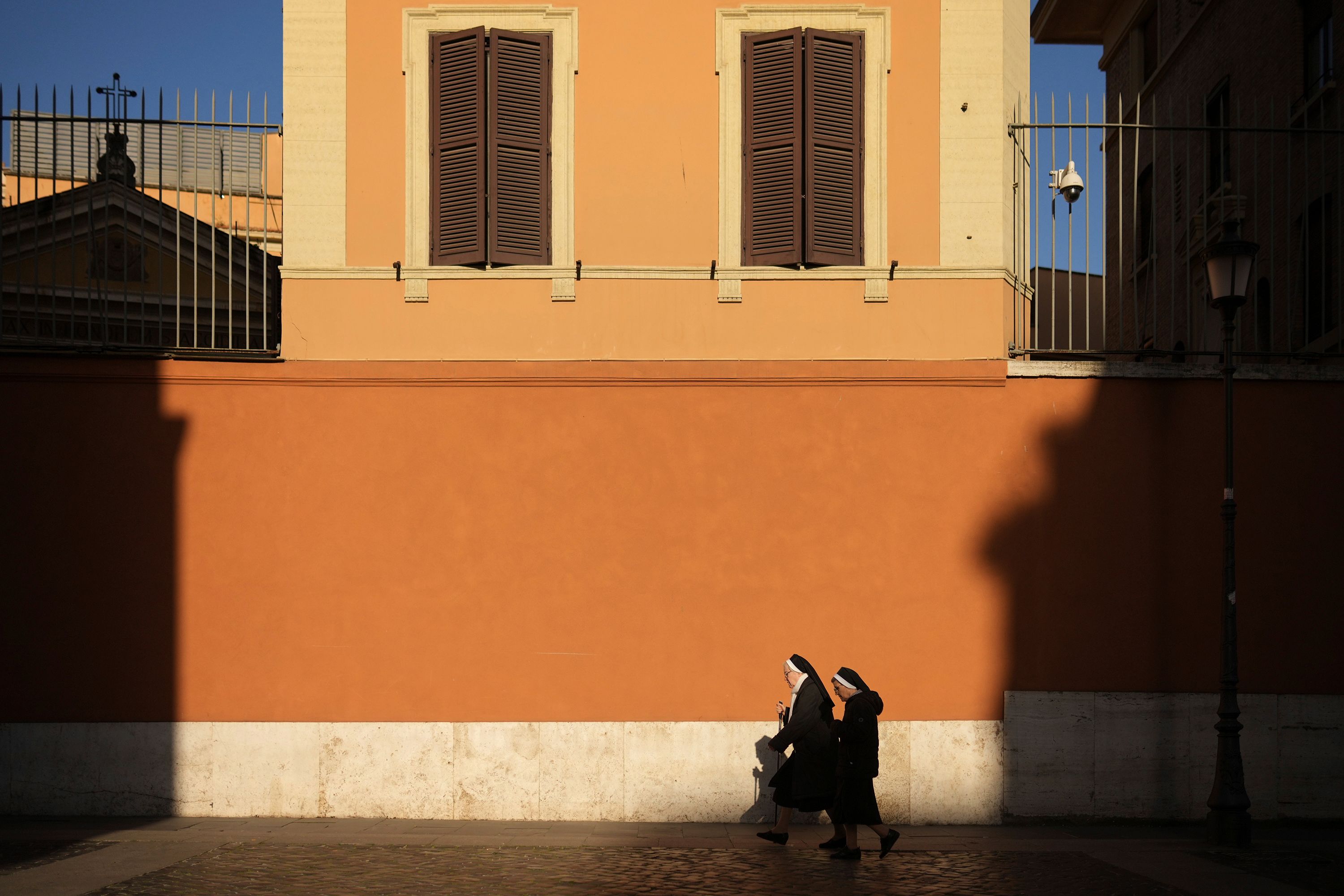 Nuns walk to Vatican City on Tuesday.