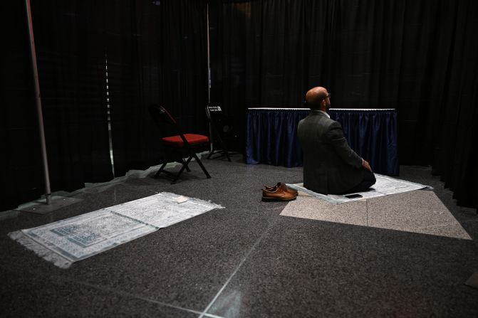 Mevlüt Hilmi Cinar prays inside the arena on Thursday.