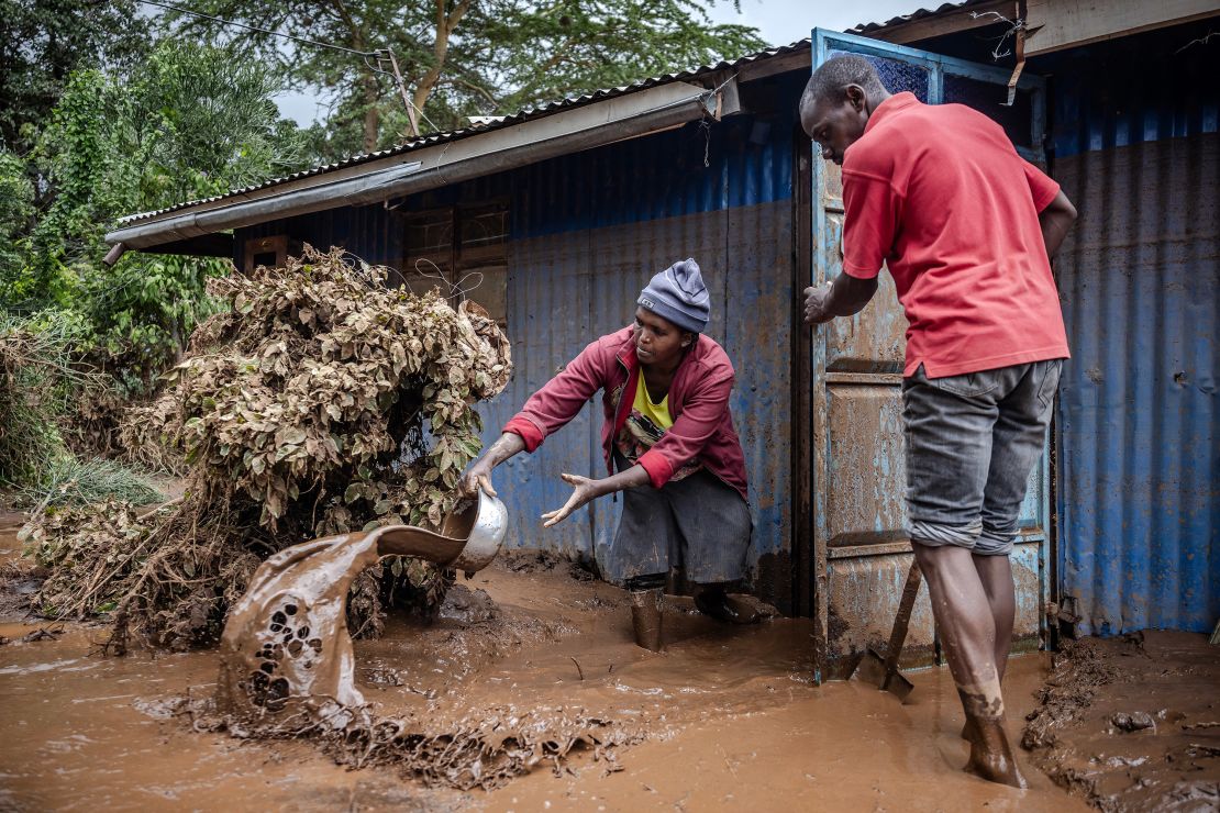 People removing mud and water from their house in Mai Mahiu, Kenya, on April 29.