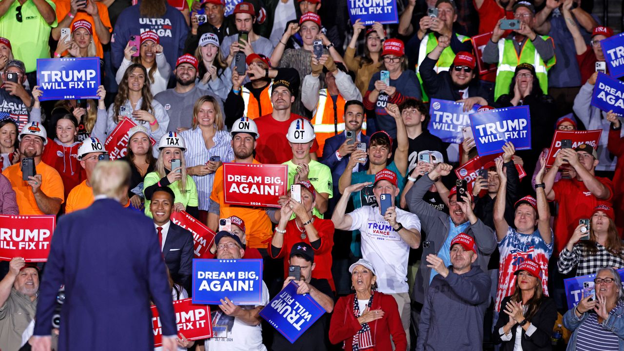 TOPSHOT - Former US President and Republican presidential candidate Donald Trump looks at supporters as he walks on stage during a campaign rally at Van Andel Arena in Grand Rapids, Michigan on November 5, 2024. (Photo by KAMIL KRZACZYNSKI / AFP) (Photo by KAMIL KRZACZYNSKI/AFP via Getty Images)