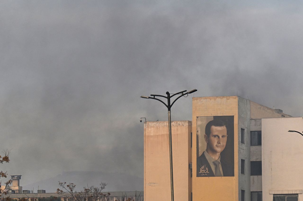 A portrait of President Bashar al-Assad is seen on a building near Umayyad Square.