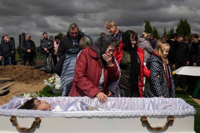A woman says goodbye to her 17-year-old grandson, Roman Martyniuk, during a funeral in Korostyshiv, Ukraine, on Wednesday, May 28. Martyniuk and his younger siblings Tamara and Stanislav <a  target="_top" href="/newspapers?url=https://www.cnn.com/2025/05/27/europe/russia-aerial-terror-ukraine-war-intl">were among those killed in Russian aerial attacks</a> over the weekend.