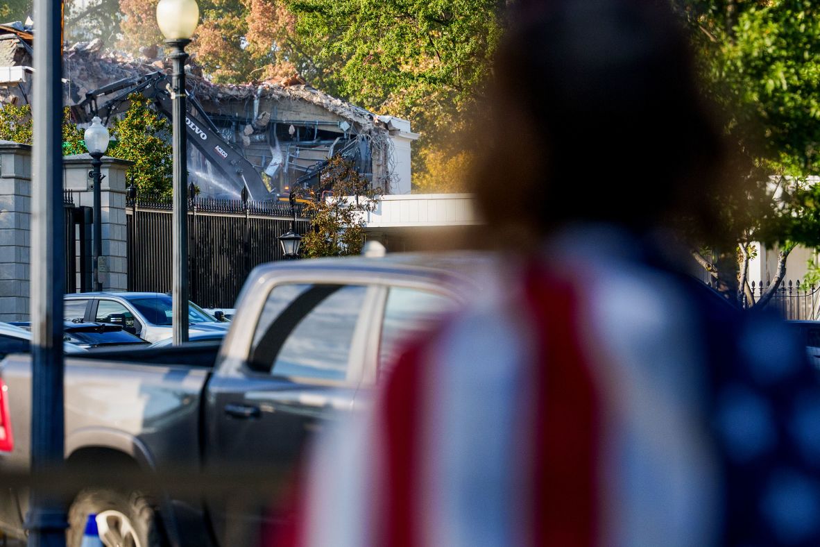 A person watches the demolition effort on October 21.