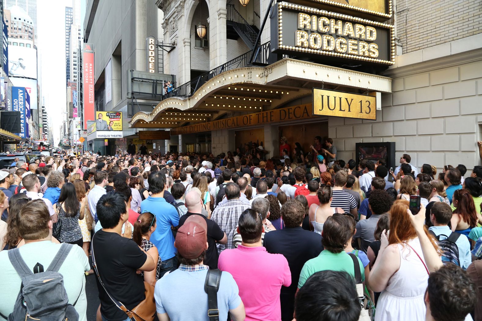 Crowds line up outside the Richard Rodgers Theatre for a chance to win $10 front-row seats to the first "Hamilton" preview show in July 2015.