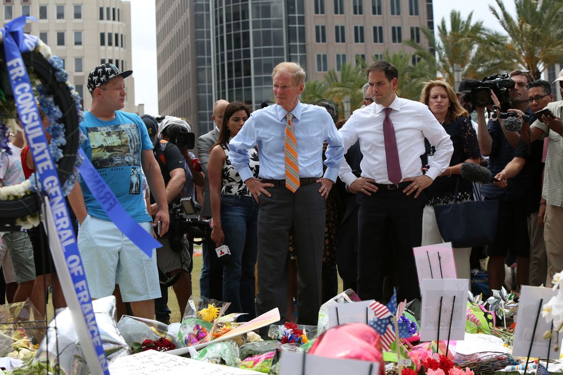 Then-Florida Sen. Bill Nelson and Sen. Marco Rubio visit the Pulse shooting victims memorial at Dr. Phillips Center for the Performing Arts in Orlando, Florida, on June 16, 2016.