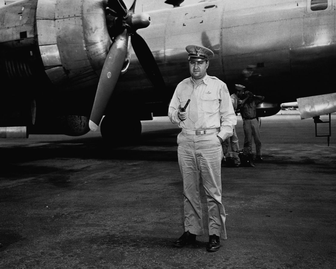 Major General Curtis LeMay, head of the bomber command against Japan, stands in front of a group of B-29 bombers at a base in the Mariana Islands.