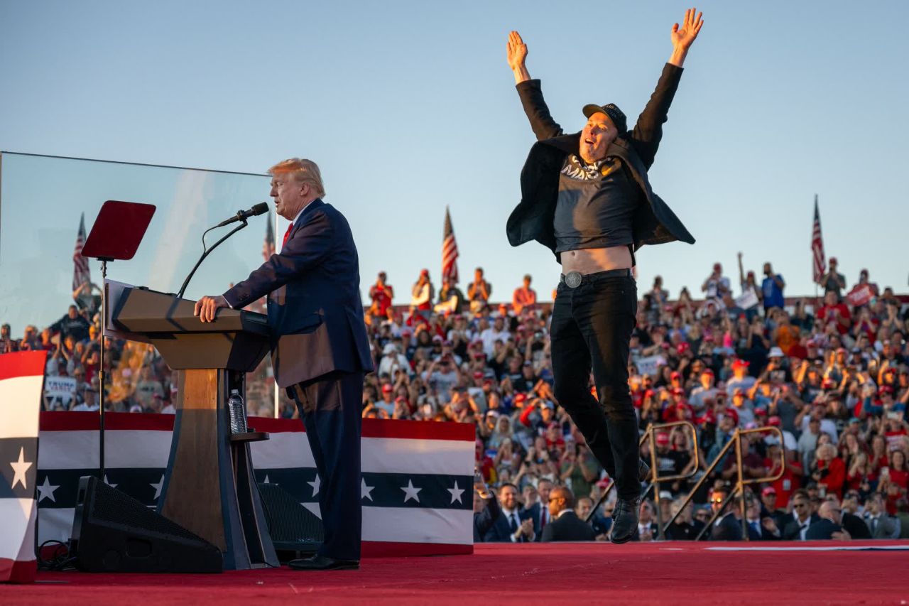 Elon Musk jumps on stage as he joins Donald Trump during a campaign rally in Butler, Pennsylvania, in October.