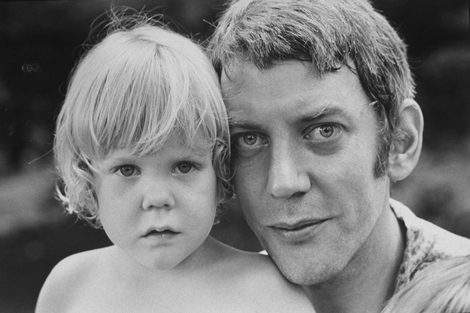 Sutherland holds his son Kiefer, who also went on to become an actor, circa 1970.