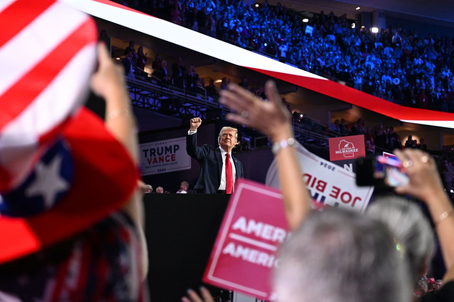 Former President Donald Trump raises his fist during the <a >Republican National Convention</a> in Milwaukee on July 18. At the convention, Trump formally accepted his party’s presidential nomination for a third straight election. His keynote speech came five days after <a >he survived an assassination attempt</a> in Butler, Pennsylvania. “I stand before you in this arena only by the grace of almighty God,” he said.