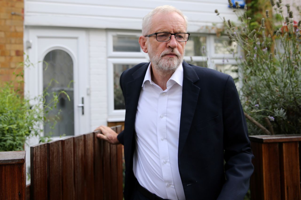 Britain's opposition Labour party leader Jeremy Corbyn leaves his home in north London Tuesday.
