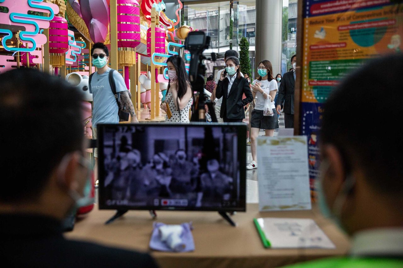 Thai officials conduct temperature screenings at a mall in Bangkok, Thailand on Tuesday.