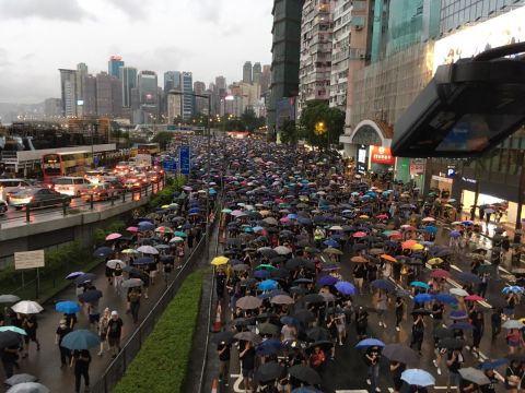 Protesters march westwards on Gloucester Road in Hong Kong.