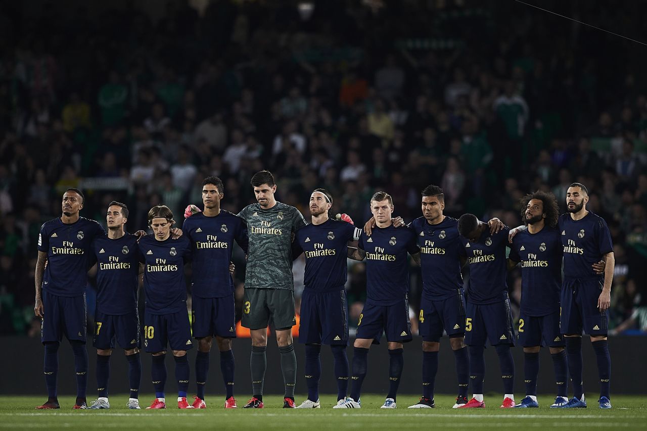 Players of Real Madrid stand on the pitch prior to a Liga match with Real Betis, in Seville, Spain, on March 8.