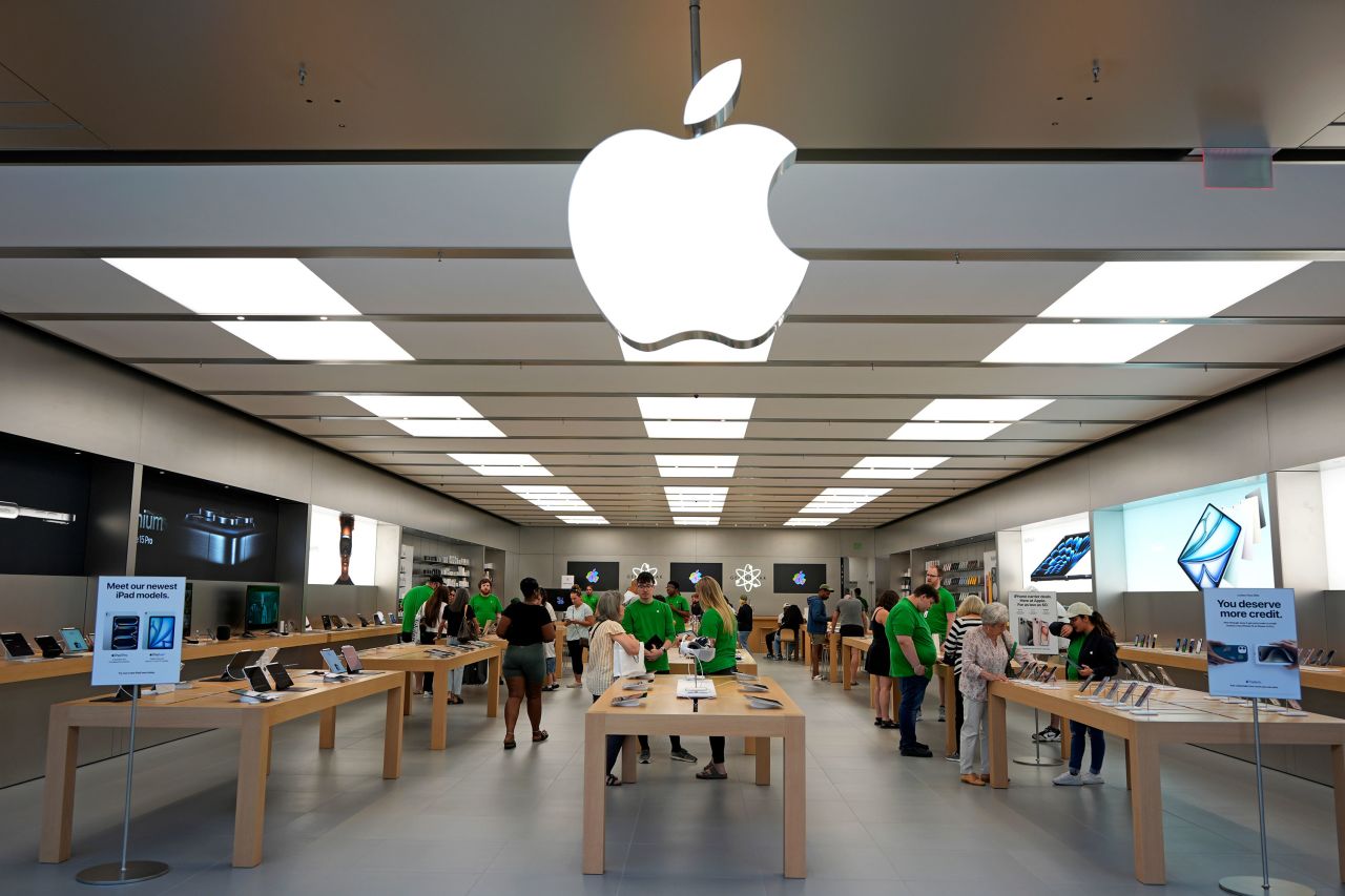 People shop at an Apple store in Pittsburgh on June 3. 