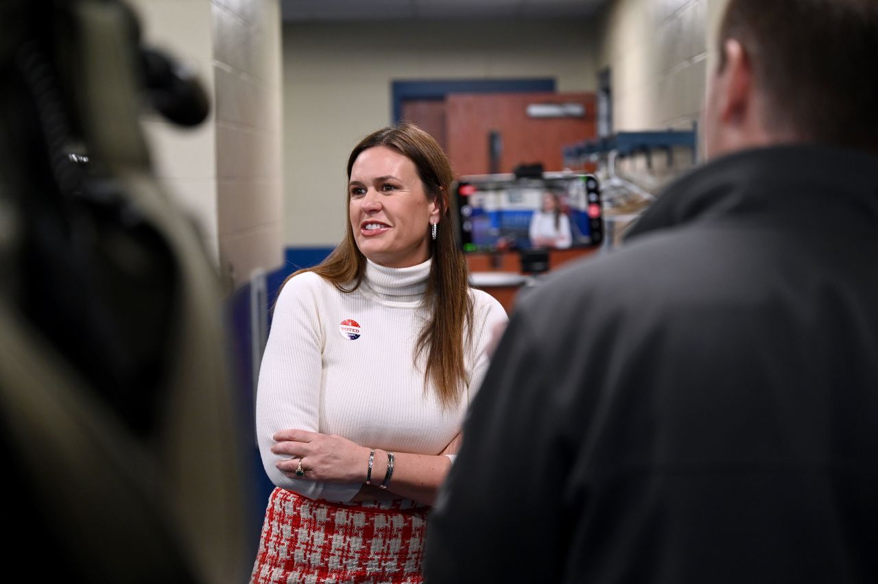 Arkansas Gov. Sarah Huckabee Sanders speaks with reporters after casting her vote in Little Rock, Arkansas.