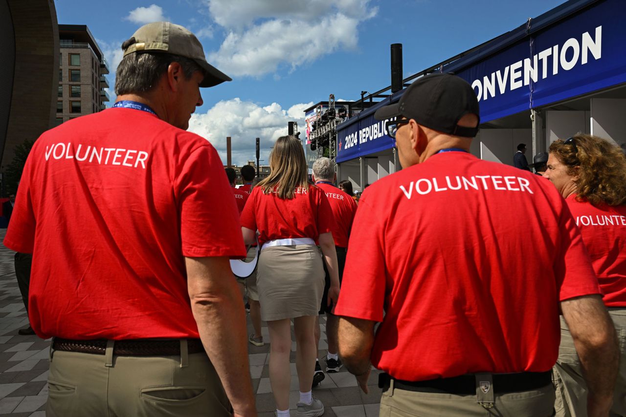 Volunteers walk through the plaza at the 2024 Republican National Convention in Milwaukee, Wisconsin, on Wednesday, July 17. 