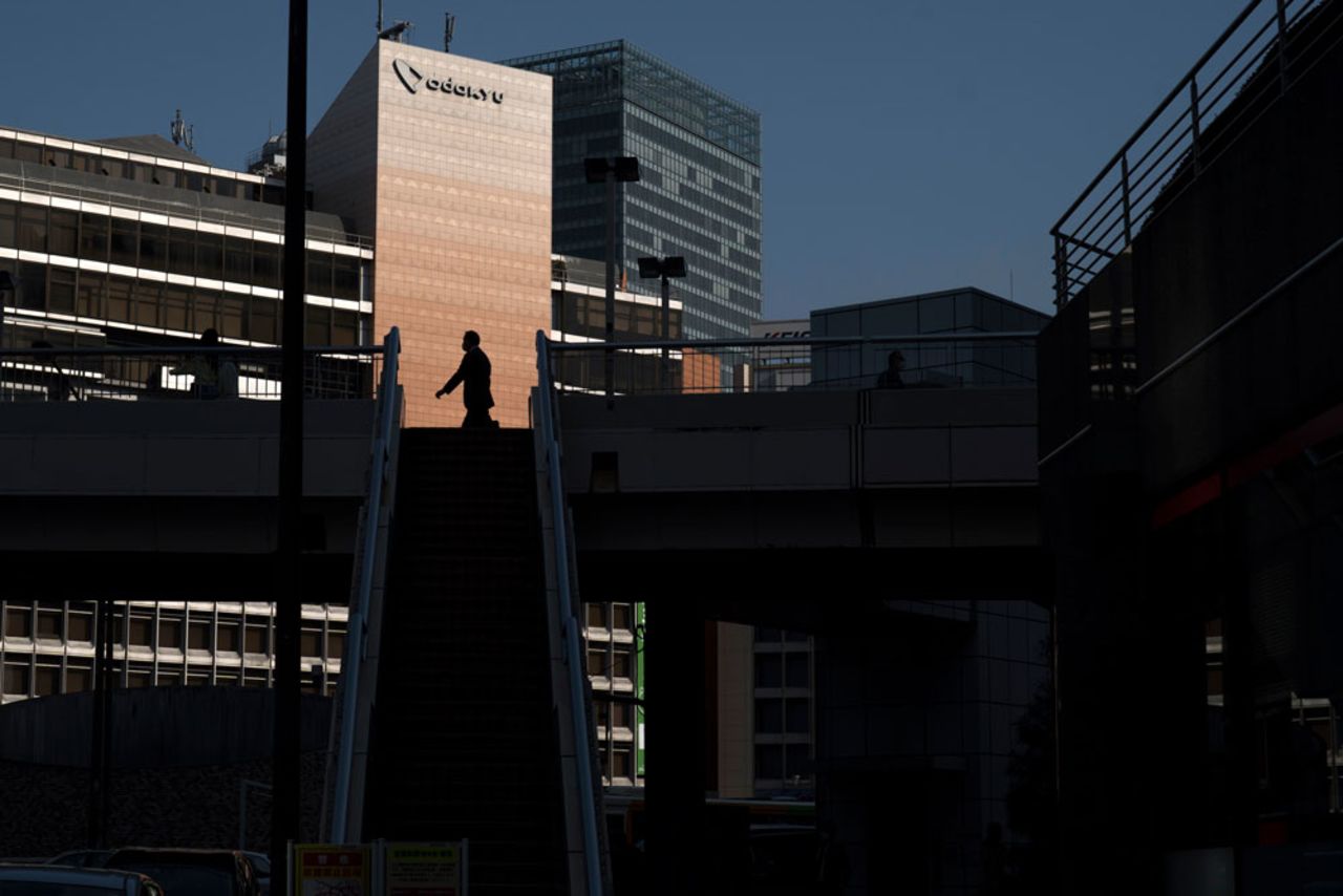 A man walks toward Shinjuku station, the world's busiest railway station, on April 8, 2020 in Tokyo, Japan.