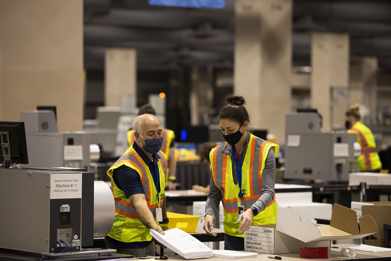 Election workers count ballots at a convention center in Philadelphia on November 4.?