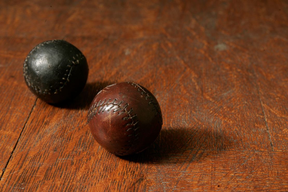 Two golf balls made from the leather of shoes worn by prisoners at Stalag Luft III, donated to the USGA Museum by Ward-Thomas.