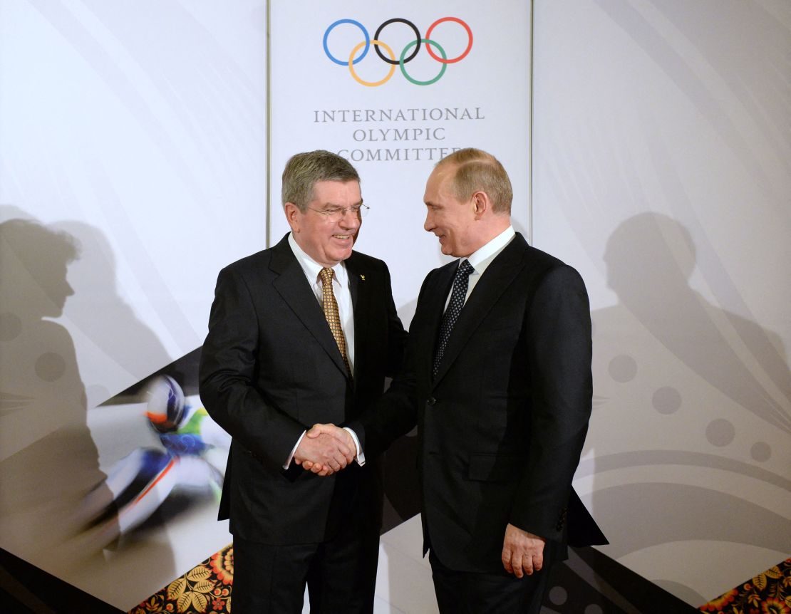 Bach, left, shakes hands with Russian President Vladimir Putin before a gala ahead of the Sochi Winter Olympics in Sochi, Russia, on February 6, 2014.