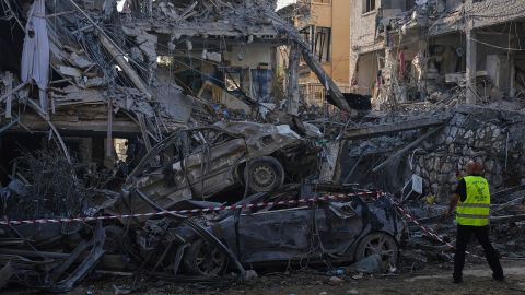 Israeli security forces inspect destroyed residential buildings that were hit by a missile fired from Iran, in Ramat Gan, near Tel Aviv, Israel, on Saturday, June 14, 2025. (AP Photo/Ariel Schalit)