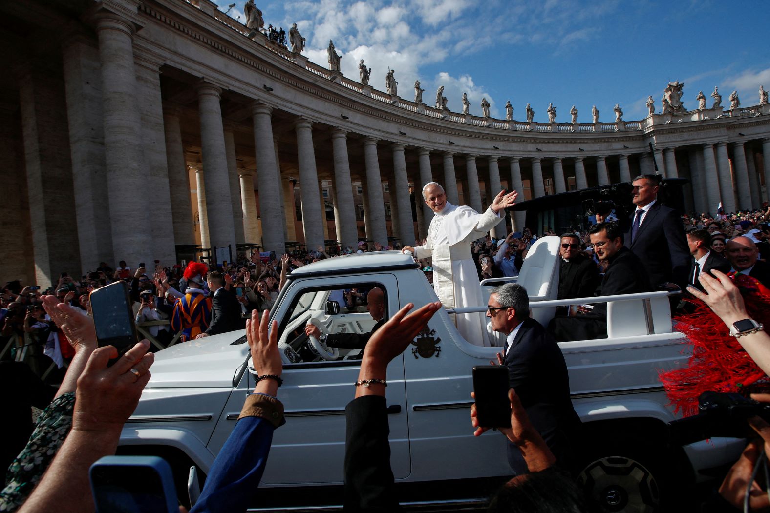 Pope Leo XIV waves from the “popemobile” ahead of <a href="https://www.cnn.com/2025/05/18/europe/pope-leo-inauguration-mass-intl">his inaugural Mass at the Vatican</a> on Sunday, May 18.