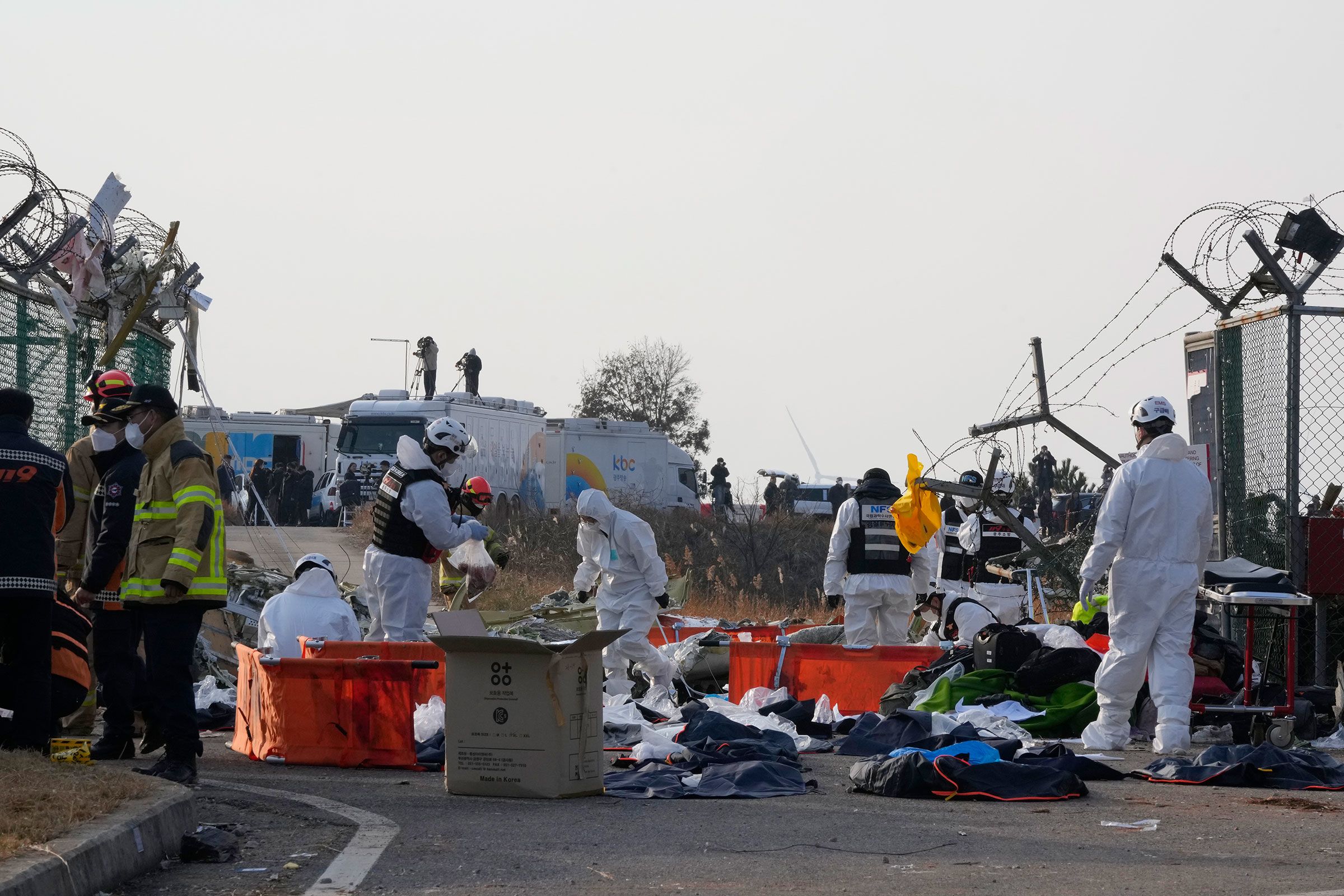 Rescue team members operate outside of Muan International Airport.