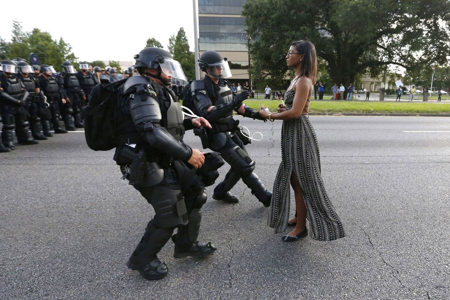 Ieshia Evans stands in the street as two police officers move in to arrest her near the headquarters of the Baton Rouge Police Department in Louisiana on July 9, 2016. She was one of hundreds of protesters who blocked a Baton Rouge roadway following the police shooting of Alton Sterling a few days earlier. For many, it became the defining image of the Black Lives Matter rallies that swept the United States that summer. “What made me most proud about the image was its ability to stimulate dialogue, which I think is one of the great hallmarks of photography,” said Jonathan Bachman, who took the photo for Reuters.