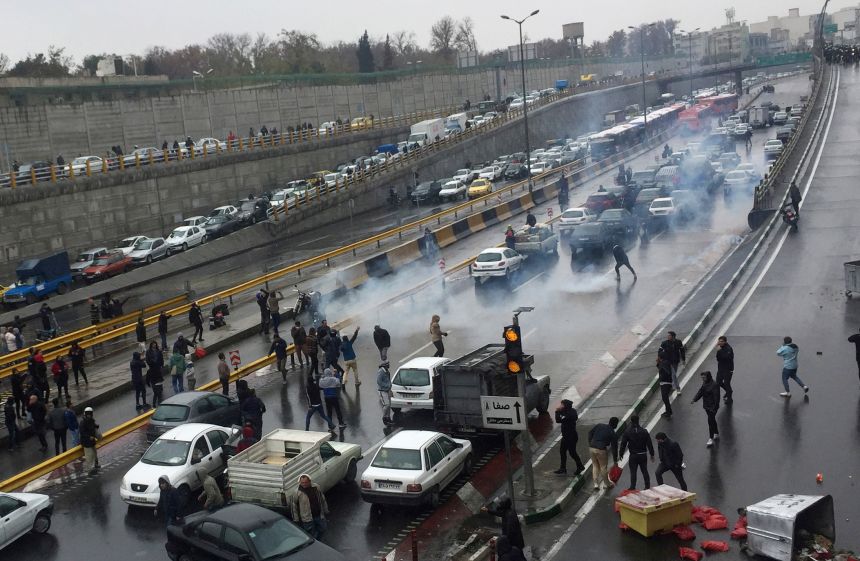 People protest against increased gas prices on a highway in Tehran, Iran, on November 16, 2019.