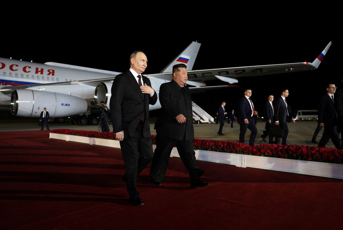 Russia's President Vladimir Putin is greeted by North Korea's leader Kim Jong Un during a welcoming ceremony at an airport in Pyongyang on June 19, 2024.