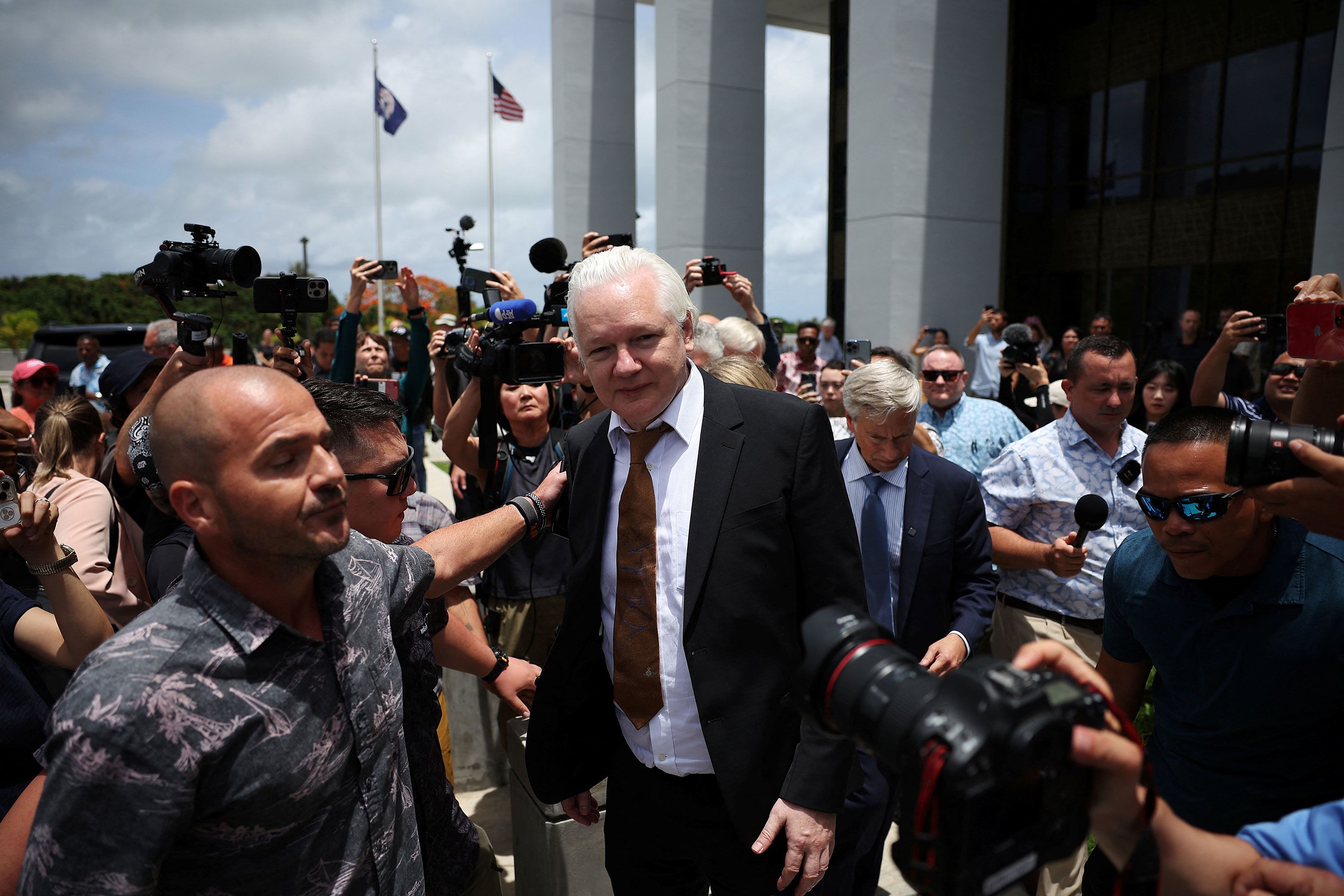 WikiLeaks founder Julian Assange leaves a courthouse in Saipan on June 26.