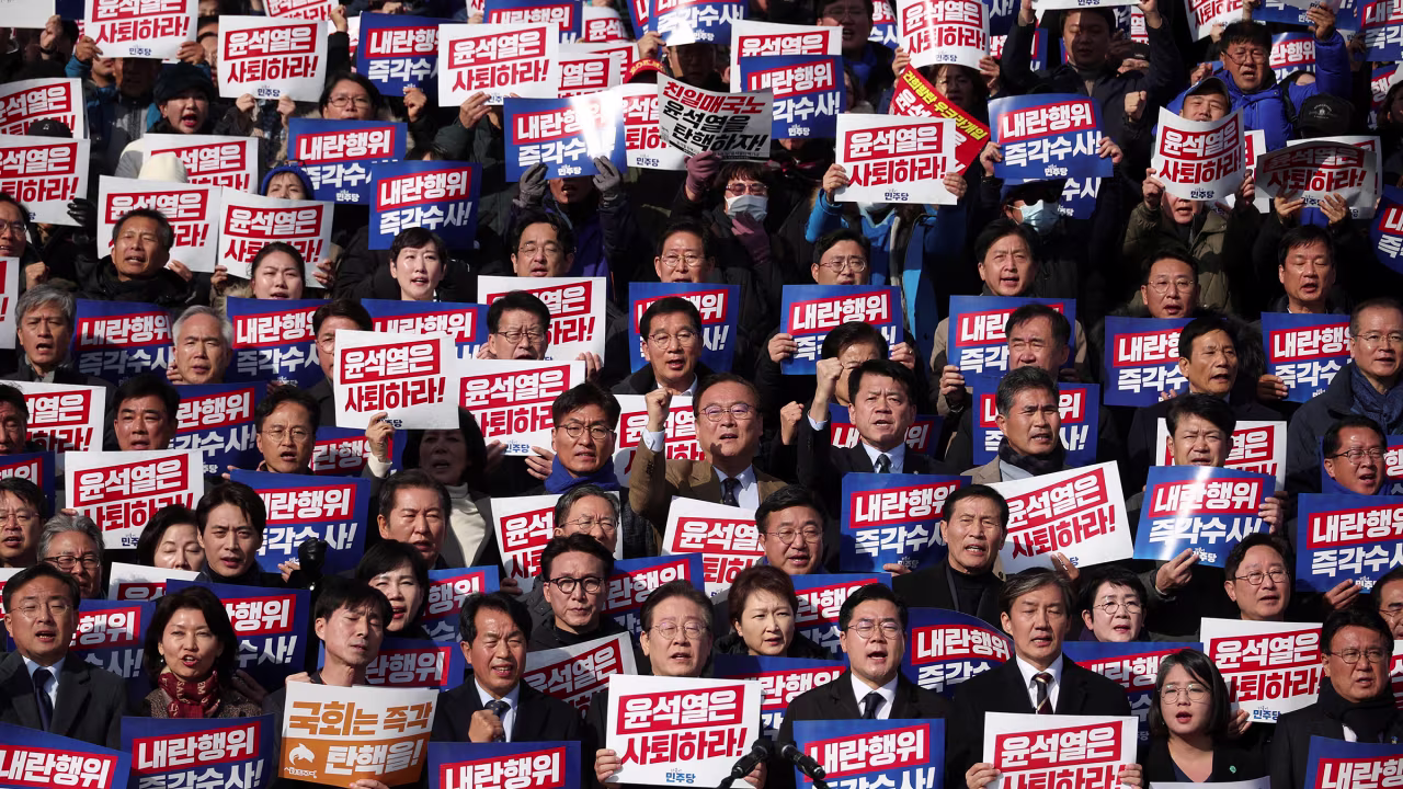 South Korea's main opposition Democratic Party leader Lee Jae-myung, lawmakers and other attend a rally to condemning Yoon's declaration of martial law.