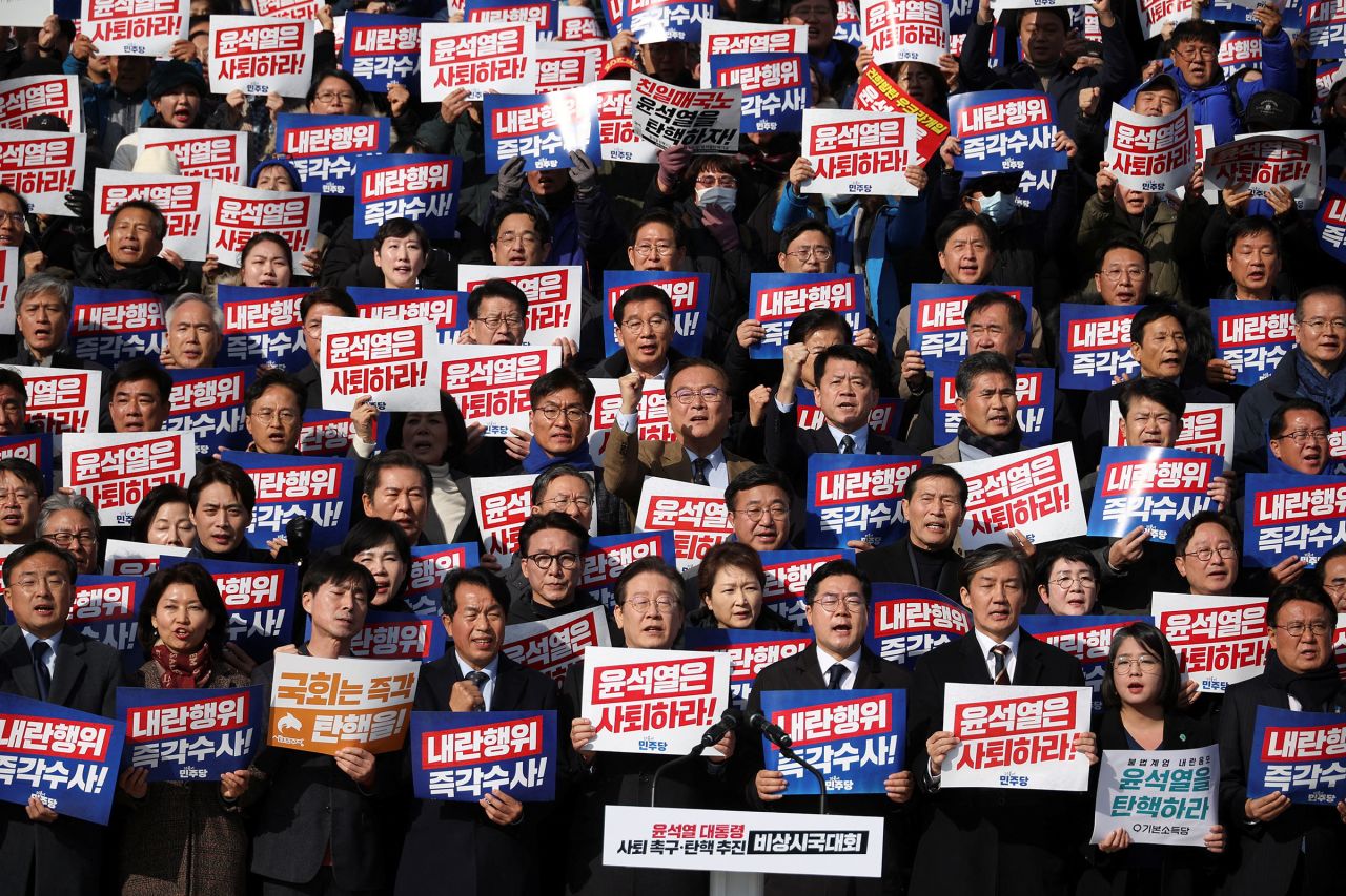 South Korea's main opposition Democratic Party leader Lee Jae-myung, lawmakers and other attend a rally to condemning Yoon's declaration of martial law.