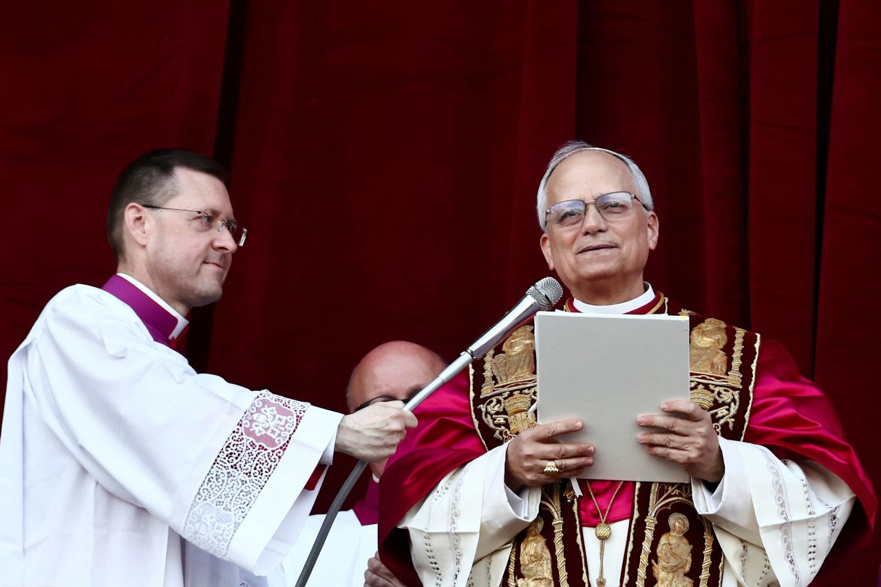 Pope Leo XIV delivers the "Urbi et Orbi" message from the balcony of St. Peter's Basilica.