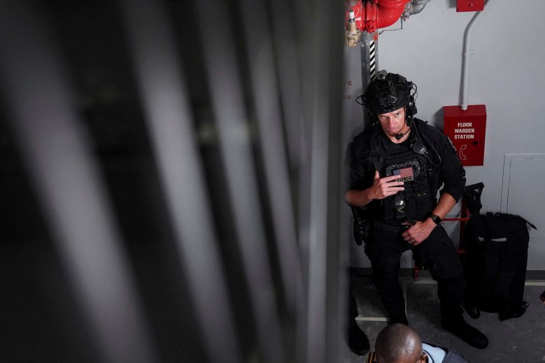 A member of the US Secret Service's Counter Assault Team (CAT) stands in a stairway following Trump's speech.